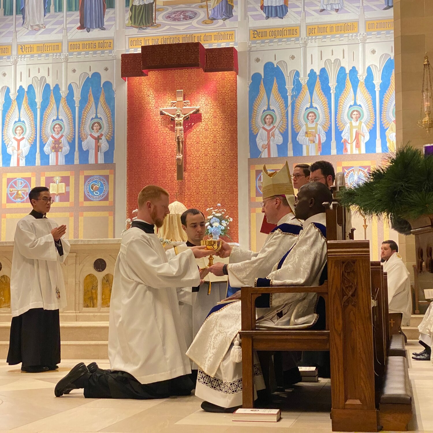 Bishop W. Shawn McKnight ceremonially presents a chalice to seminarian Christopher Hoffmann, a seminarian for the Jefferson City diocese who has since been ordained a transitional deacon, while instituting him as an acolyte in the chapel of the Pontifical College Josephinum on Dec. 8, 2021.